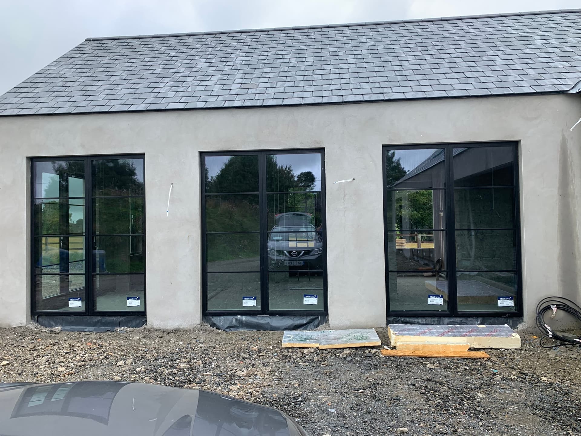 Slim aluminium-framed windows on a rendered Dublin home, installed by MDM Windows & Doors