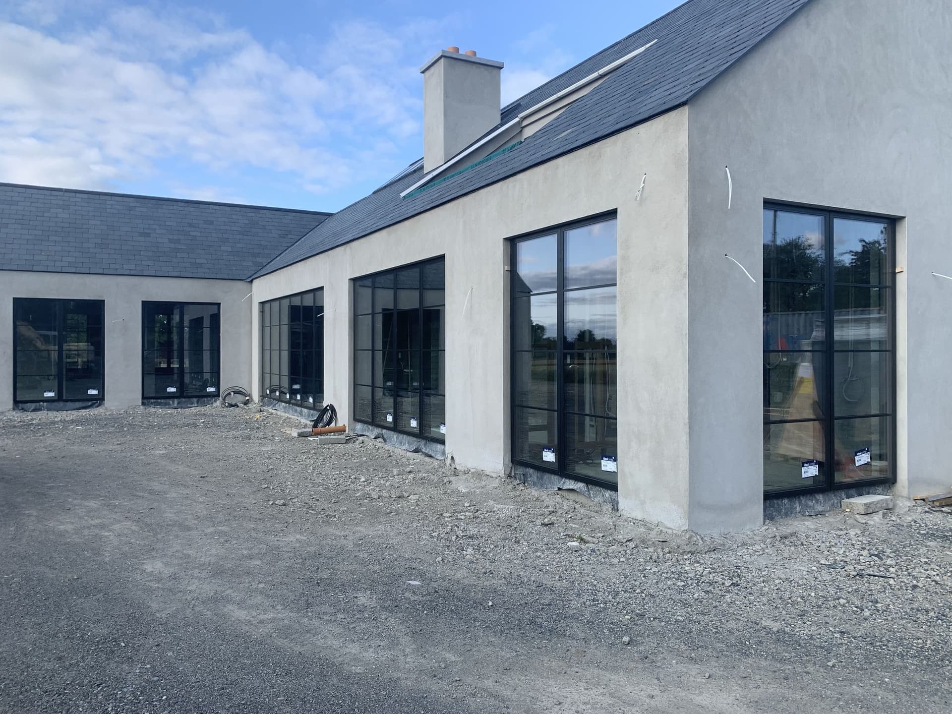 New build home fitted with black-framed Idealcombi windows by MDM Windows & Doors
