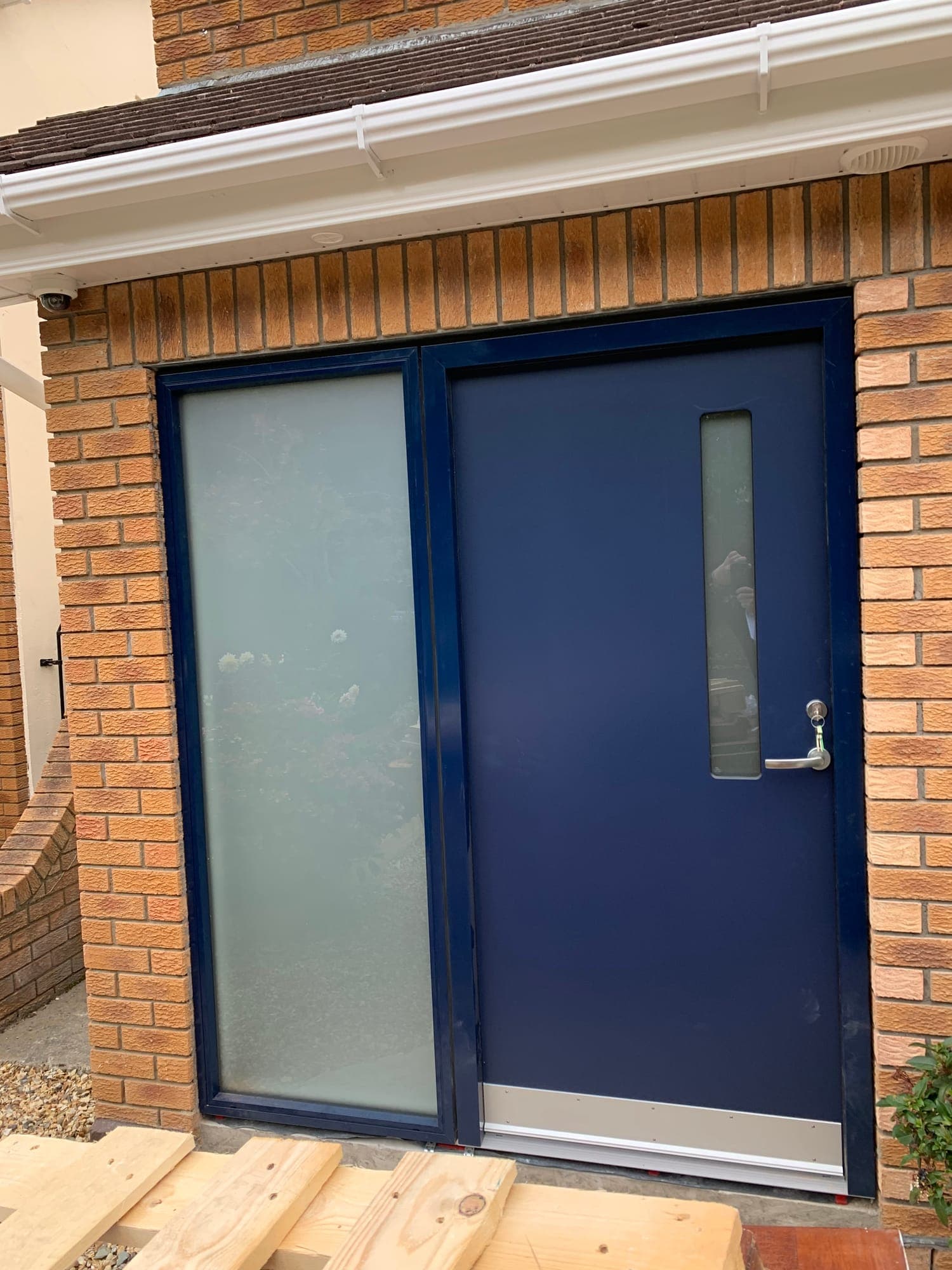 Navy composite front door with a glazed side panel on a Dublin home, installed by MDM Windows & Doors